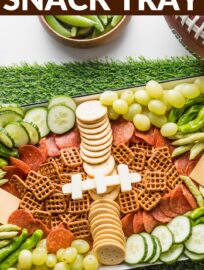 Celebrate game day with this fun, festive, and easy football snack tray full of veggies and small savory bites. It's a great addition to a party spread but also just makes a fun treat for the family to turn watching your team into a special occasion.