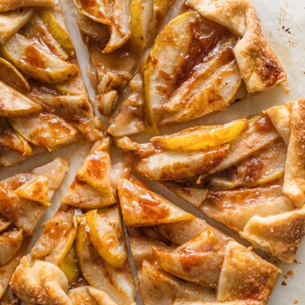 A pear caramel galette just baked and cut into eight wedges, ready to serve.