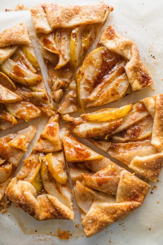 A pear caramel galette just baked and cut into eight wedges, ready to serve.