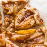Close up of a slice of pear caramel galette.
