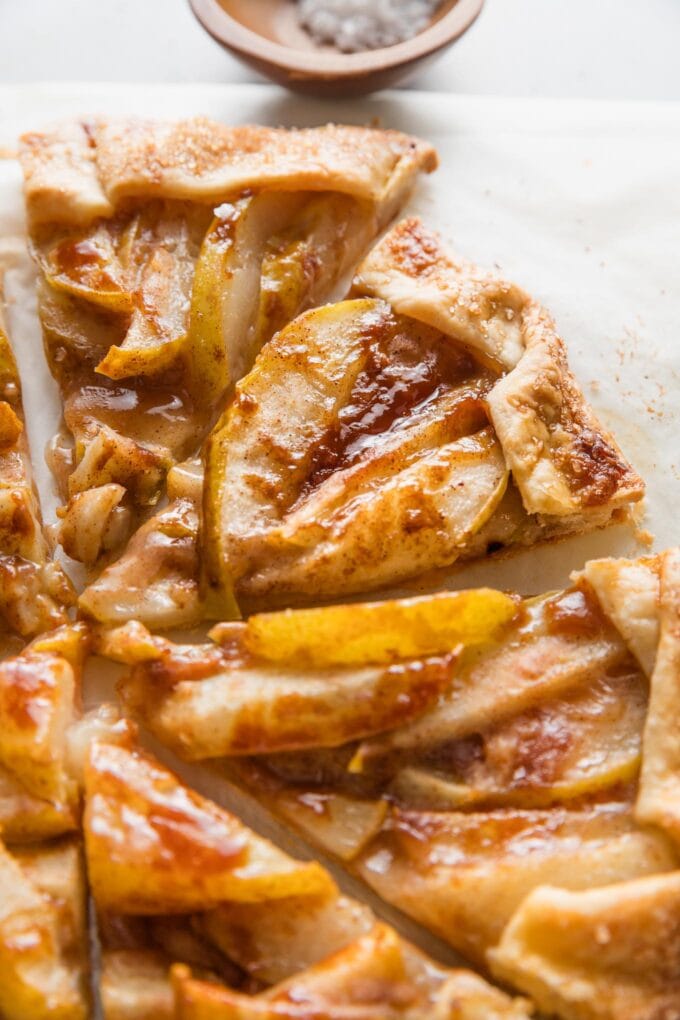 Close up of a slice of pear caramel galette.