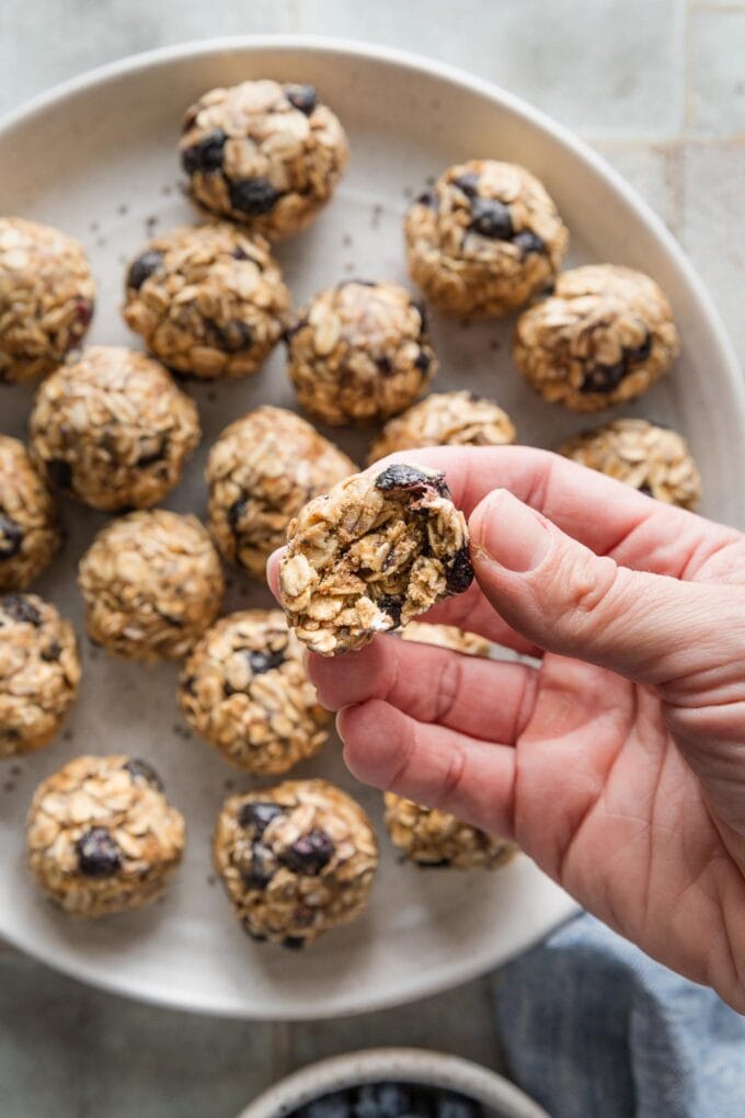 Close up of the inside of a protein snack ball made with freeze-dried blueberries and chia seeds.