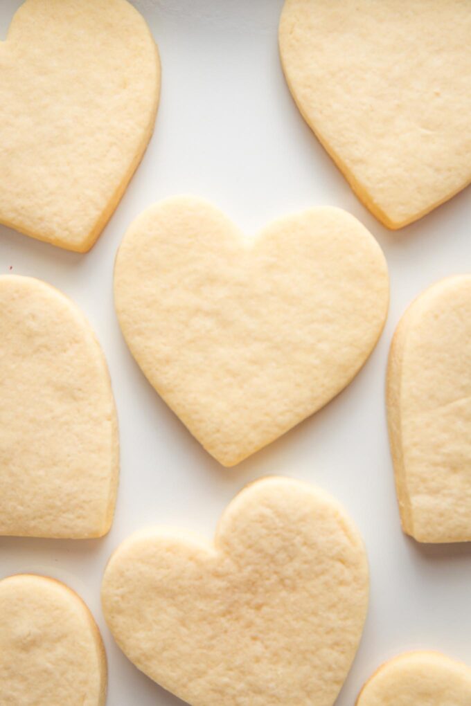 Baked, undecorated heart shaped cut out sugar cookies.