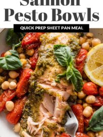 Pesto Salmon Bowls with Chickpeas are fresh, vibrant, and packed with flavor despite the simple ingredient list and minimal prep. Tender salmon is slathered in pesto and roasted alongside plump cherry tomatoes and creamy chickpeas for the most satisfying lunch or dinner. Easy to meal prep, as well.