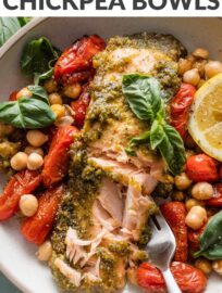 Pesto Salmon Bowls with Chickpeas are fresh, vibrant, and packed with flavor despite the simple ingredient list and minimal prep. Tender salmon is slathered in pesto and roasted alongside plump cherry tomatoes and creamy chickpeas for the most satisfying lunch or dinner. Easy to meal prep, as well.