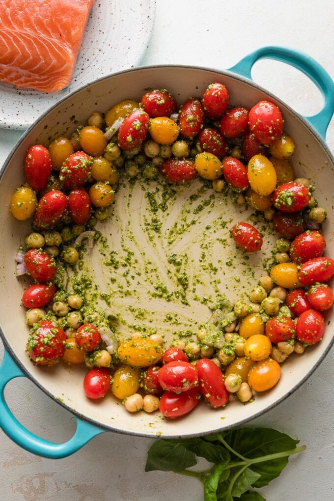 Pesto tomato chickpea mixture pushed to the outer edge of the pan.