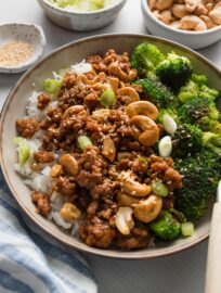 This Sesame Cashew Chicken recipe uses lean ground chicken and a 4-ingredient homemade sauce to unlock a flavorful meal. It takes just about 20 minutes and one skillet only. Paired with broccoli or edamame, rice, and plenty of extra sesame seeds, it’s one of my favorite easy lunches or dinners.