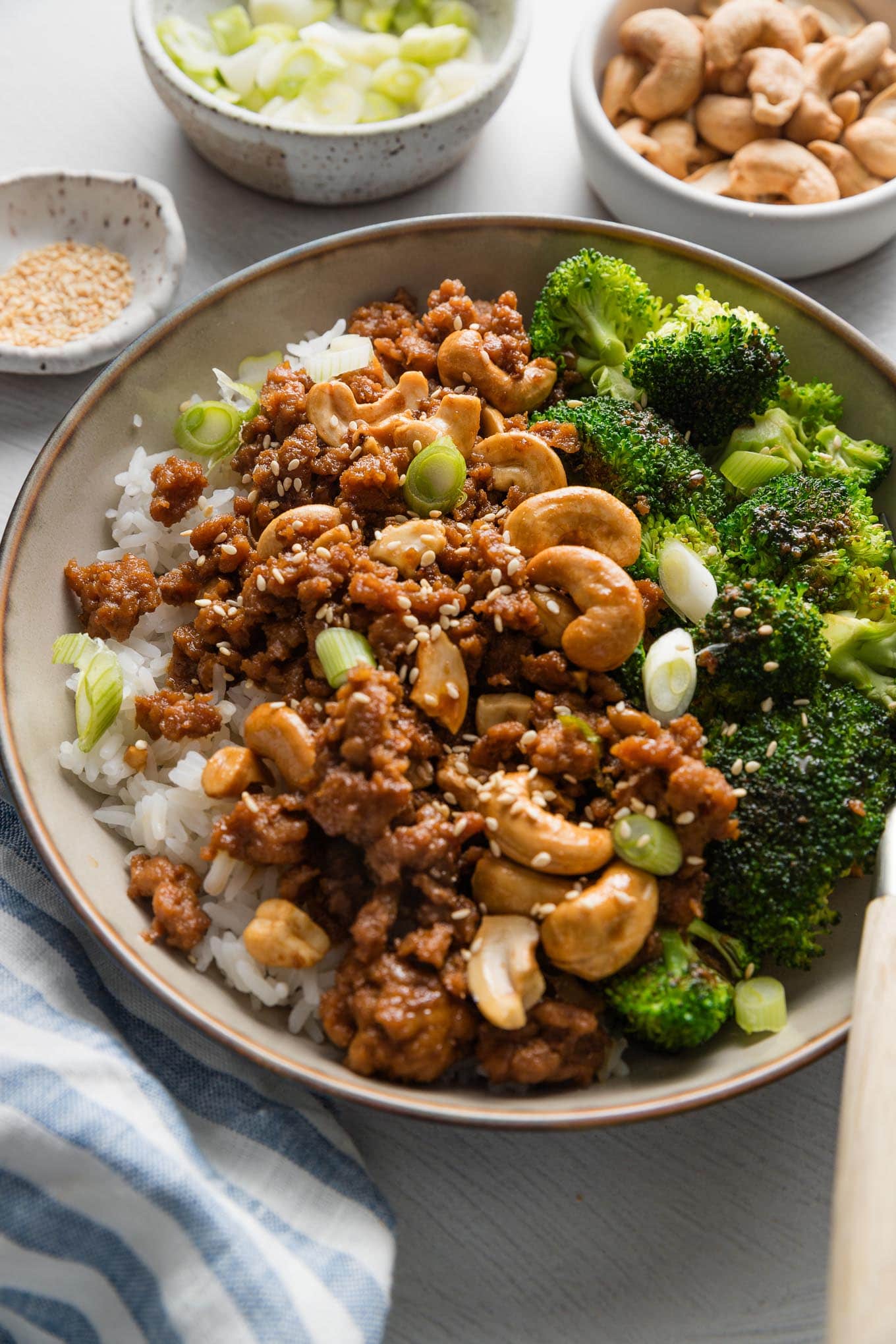 This Sesame Cashew Chicken recipe uses lean ground chicken and a 4-ingredient homemade sauce to unlock a flavorful meal. It takes just about 20 minutes and one skillet only. Paired with broccoli or edamame, rice, and plenty of extra sesame seeds, it’s one of my favorite easy lunches or dinners.