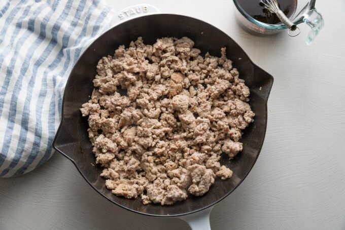 Ground chicken browned in a cast iron skillet with a few cloves of garlic, minced.