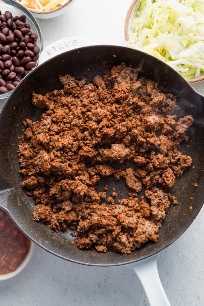Browned ground beef seasoned with chili powder, paprika, cumin, garlic powder, onion powder, and salt.