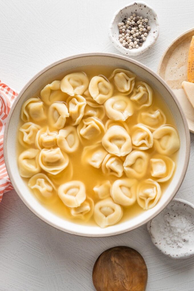 Bowl of cheese tortellini simmered in bone broth.
