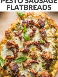 This pesto sausage flatbread is flavorful, satisfying, and ultra-easy to make. It has rich crumbles of Italian sausage, creamy mozzarella, tangy Parmesan and sun-dried tomatoes, all scattered on a simple crust for a dinner you can make in about 20 minutes.