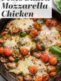Pesto Baked Mozzarella Tomato Chicken is one ultra-flavorful dinner that largely bakes itself! It's got juicy, pan-seared chicken breasts smothered with pesto, topped with gooey mozzarella, and roasted alongside sweet cherry tomatoes. The result is a simple, flavorful dinner that comes together in one pan with everyday ingredients!