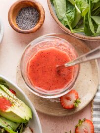 Jar of homemade strawberry vinaigrette.