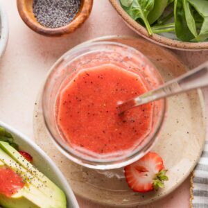 Jar of homemade strawberry vinaigrette.