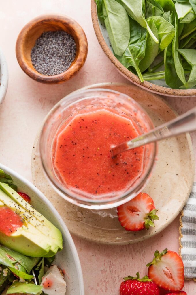 Jar of homemade strawberry vinaigrette.