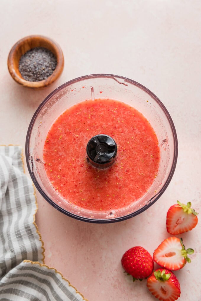 Strawberry salad dressing blended in a miniature food processor.