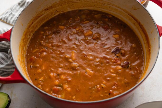 Turkey pumpkin chili simmering in a large pot.