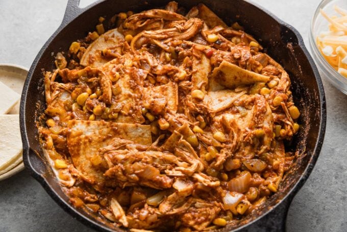 Tortilla wedges tucked into a chicken enchilada casserole mixture.