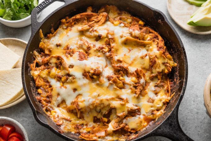 Corn and chicken enchilada skillet just pulled from the oven and cooling slightly on the counter.