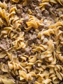 Close up of ground beef and noodles in a simple homemade cream sauce, just finished in a large skillet.
