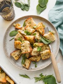 Small plate full of cozy bread stuffing with herbs.