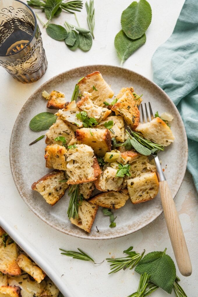 Small plate full of cozy bread stuffing with herbs.