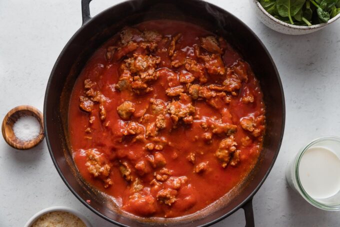 Tomato cream sauce with crumbles of sausage.