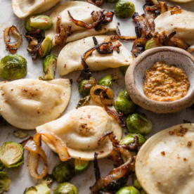 This recipe for sheet pan pierogies with Brussels sprouts and richly caramelized onions is the easiest way to upgrade the humble pillows of dough and cheese. Simple seasonings, crisp-tender veggies, and the simplicity of oven roasting are just what weeknights need.