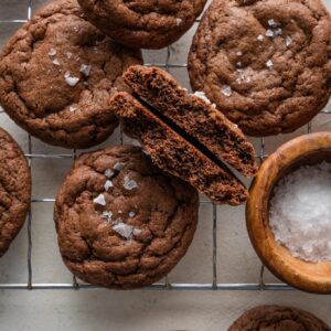 Close up of a chocolate cookie split in half to reveal the fudgy interior.