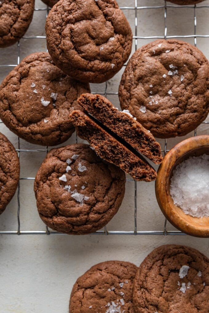 Close up of a chocolate cookie split in half to reveal the fudgy interior.