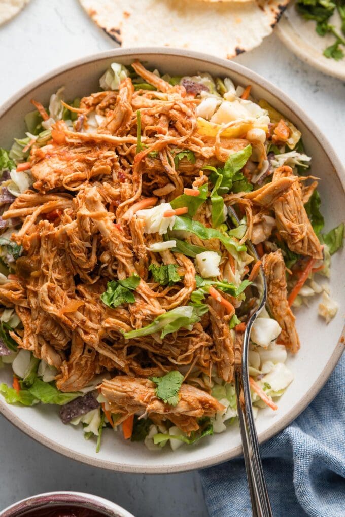 Tex-Mex salad served with a generous helping of salsa chicken made in the Instant Pot.