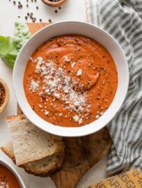 This creamy tomato butternut bisque is everything we love in a bowl of soup: it tastes rich and satisfying, yet every spoonful is packed full of vibrant vegetables. Just as important, it's quick and easy to make, with very little hands-on effort required. This is tomato soup, elevated, and a must try!