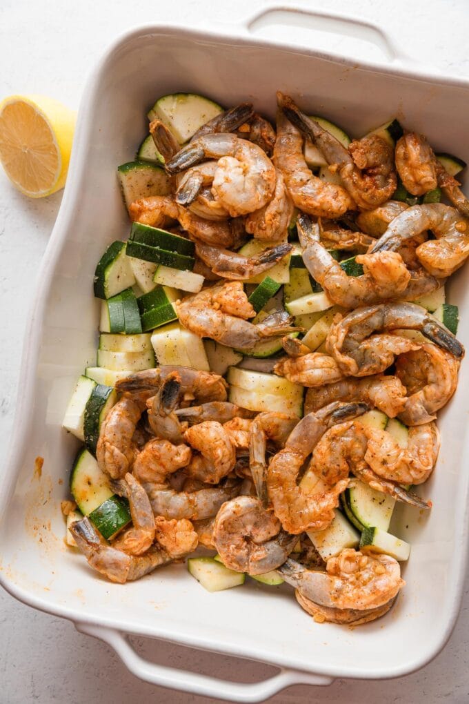 Uncooked shrimp mixed in with zucchini to bake.