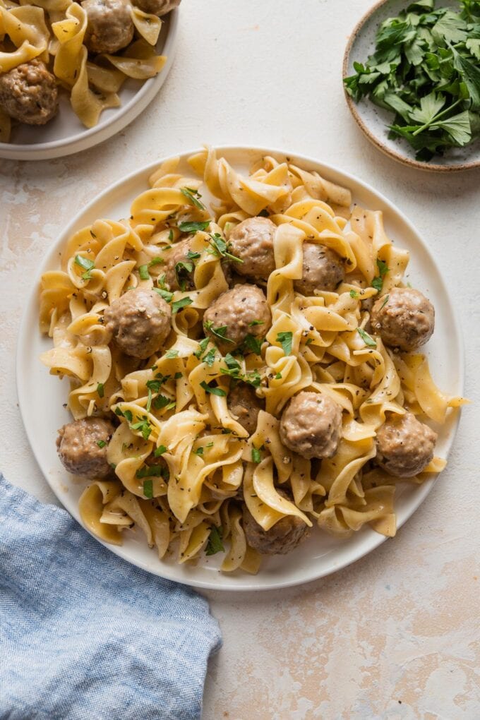 Plate of Swedish meatballs with egg noodles and homemade sauce.