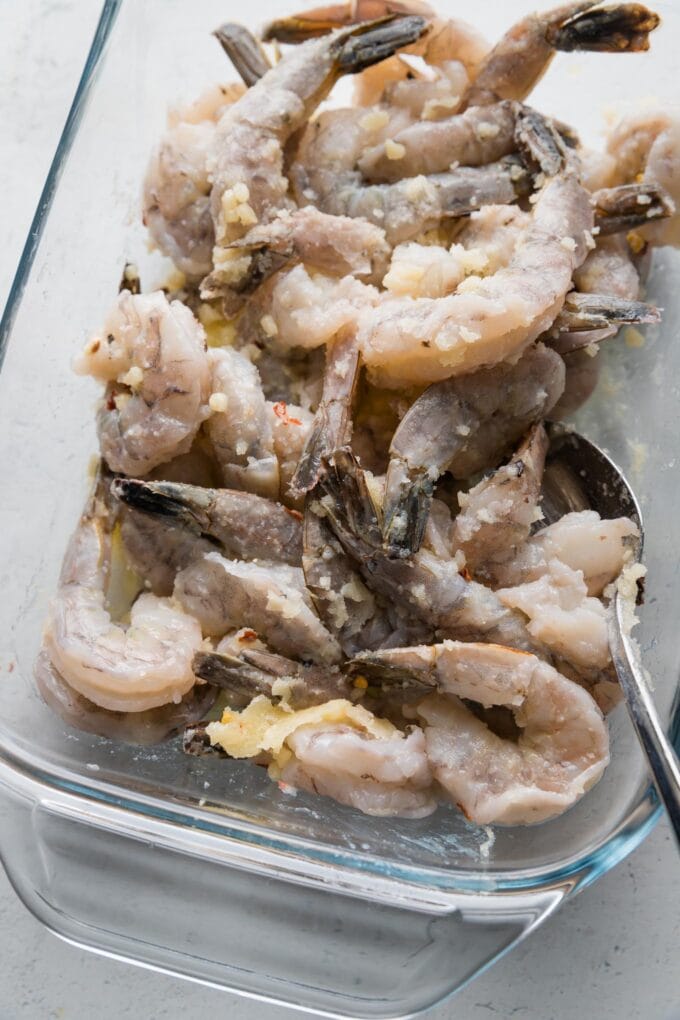Butter with lemon and garlic tossed over shrimp.