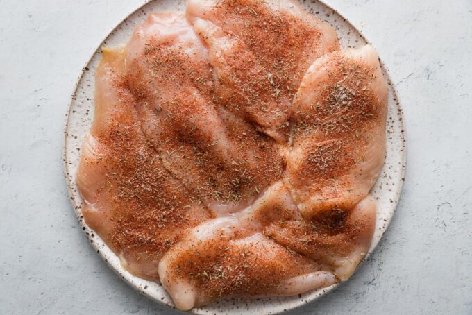 Thin-sliced chicken cutlets sprinkled with a paprika spice mixture.