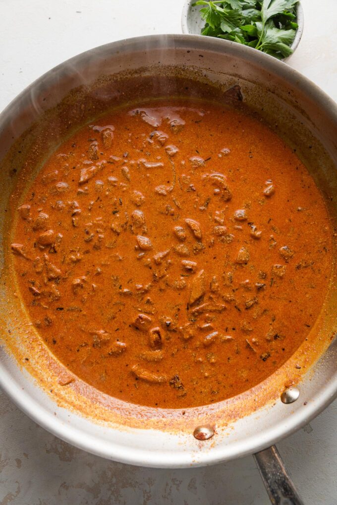 Creamy paprika sauce in a skillet.