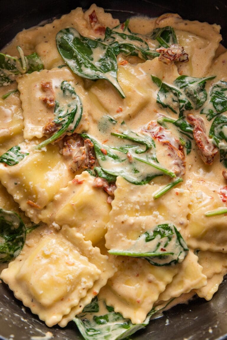 Close up of a 20 minute Tuscan ravioli recipe in a skillet.