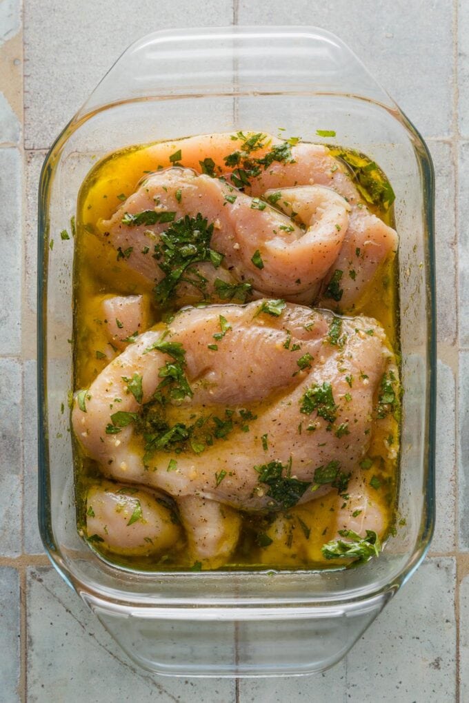 Chicken breasts marinating in a homemade cilantro lime chicken.
