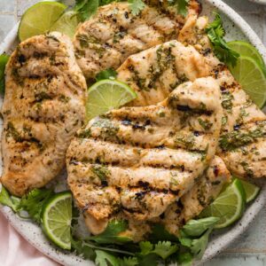 Large plate full of grilled cilantro lime chicken.