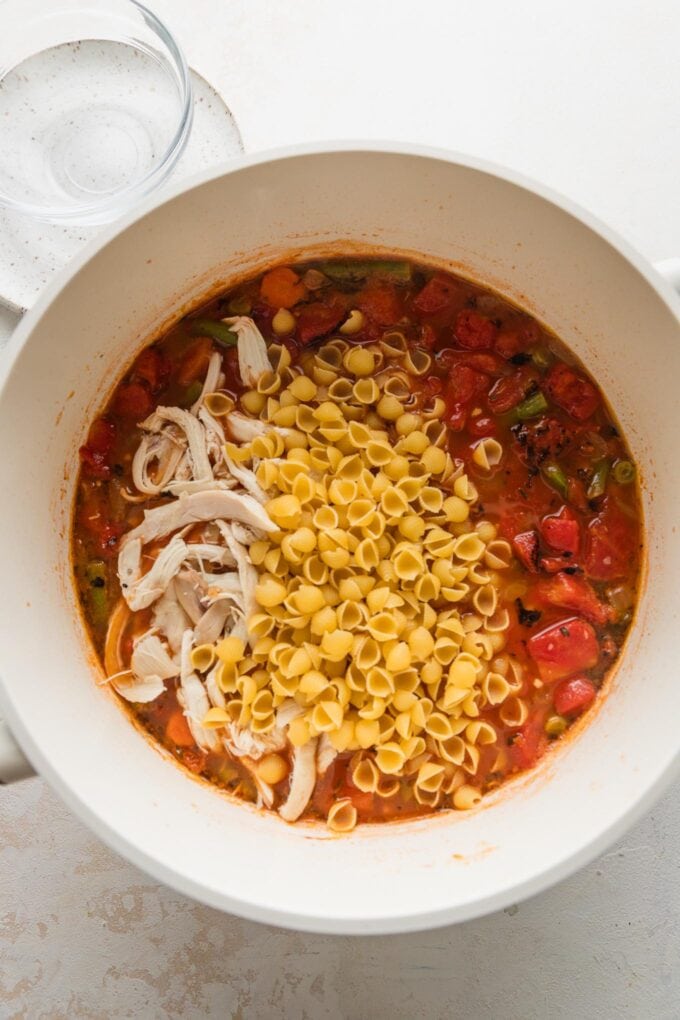 Shredded rotisserie chicken and pasta added to soup.