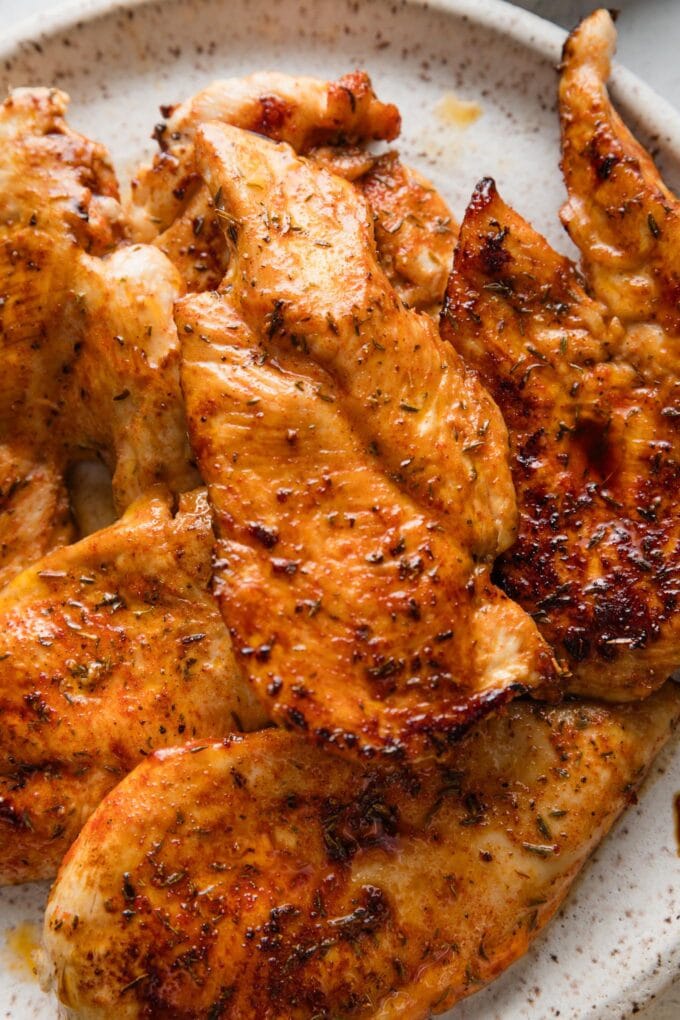 Pan-seared chicken cutlets, deep golden brown with a light crust from a brown sugar seasoning mix.
