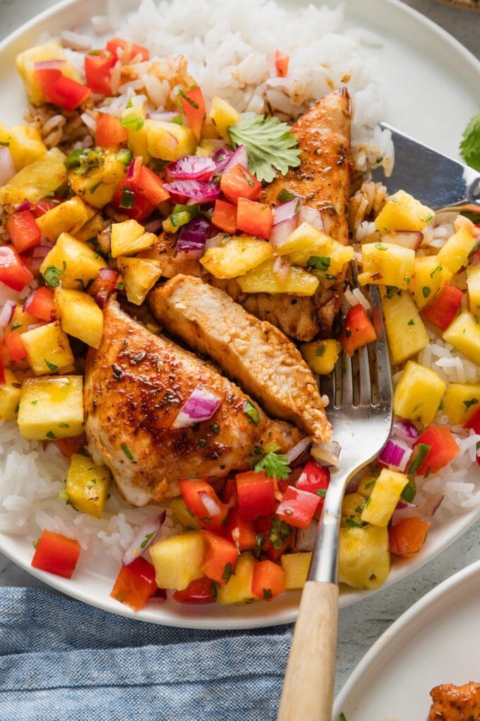 Chicken breast seasoned with a sweet and savory brown sugar rub, pan-seared, and served with pan sauce and pineapple salsa.
