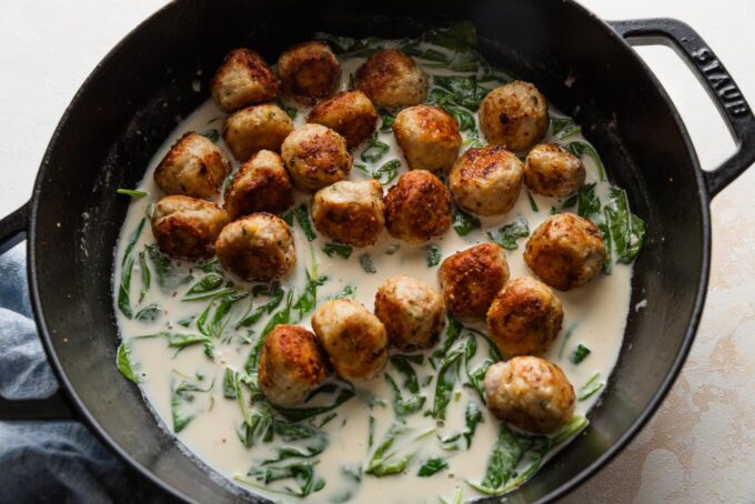 Chicken Florentine meatballs added back to a homemade pan sauce.