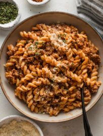 Bowl of easy rotini pasta with tomato sauce and Parmesan.