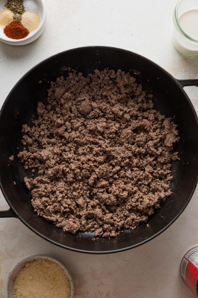 Ground beef browned in a skillet.