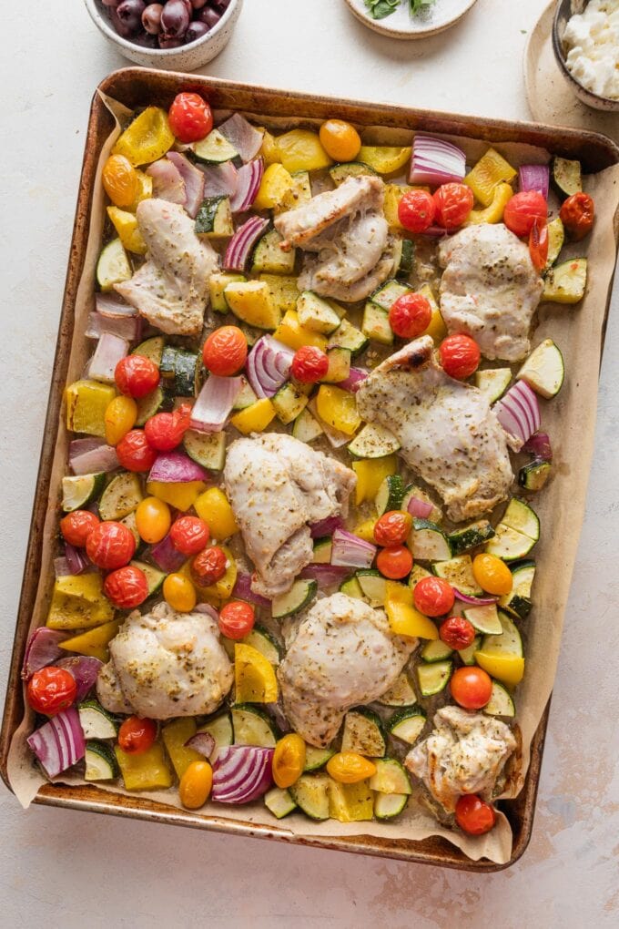 Roasted Greek sheet pan chicken and veggies, just pulled from the oven.
