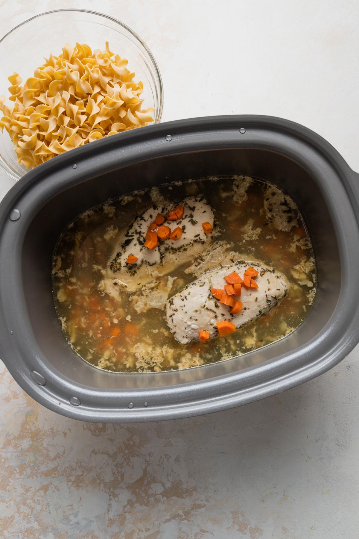 Cooked chicken breasts in slow cooker.