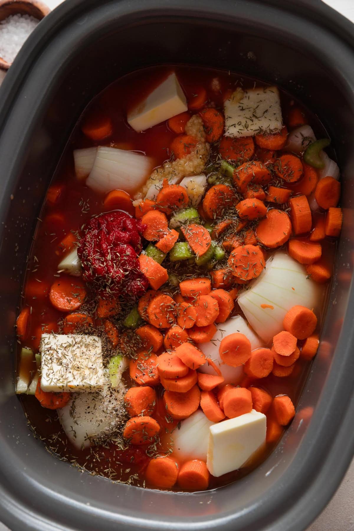 Soup ingredients mixed in a slow cooker and not yet cooked.